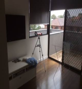 A camera on a tripod in a room with a window

Description automatically generated with medium confidence