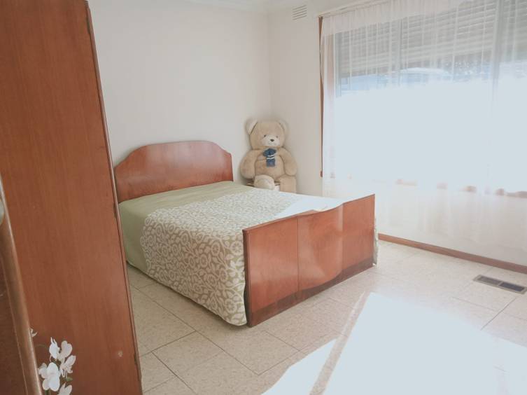 A teddy bear on a bed

Description automatically generated with medium confidence